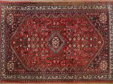un tapis rouge et bleu orné d'un motif en forme de diamant