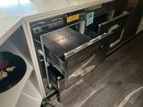 an oven that is open in the kitchen