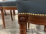four chairs that are sitting in a room together