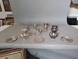 a table with a lot of silver items on it