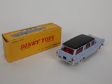 a toy car that is sitting next to a box