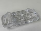 a clear glass ashtray on a white table