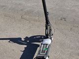 a scooter that is sitting on the pavement