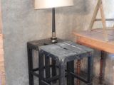 a small table with a lamp on it in a room