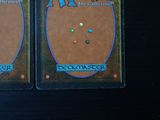 two cards that are sitting on a table