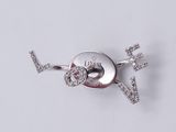 a silver brooch with a heart and a key on it