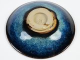 a picture of a blue and white bowl on a white surface