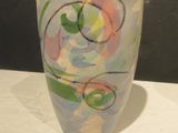a cup with a design on it sitting on a table