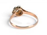 an image of a gold ring with a stone in the center