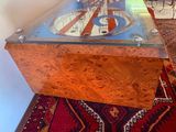 a glass table with a clock on top of it