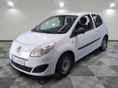 a picture of a small white car parked on a checkered floor