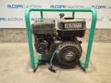 a close up of a small engine on a stand in front of a sign