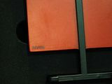 a red book sitting on top of a black table