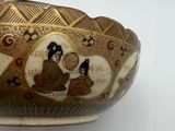 a bowl with a picture of a man and a woman on it