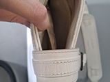a person that is holding a wallet in their hand