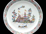 a plate that has a picture of a castle on it