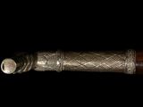 a close up of a knife on a black background
