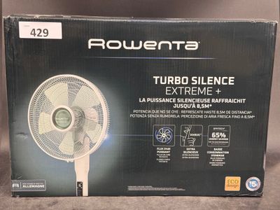 the box of a box of a table top fan on a table