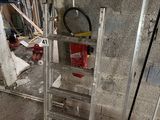 a ladder that is sitting in the middle of a room