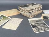 several old postcards are stacked on top of each other on a table