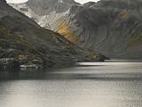 a boat that is sitting in the middle of a lake