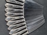 a lot of spoons that are sitting on a table