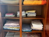 an image of a closet full of folded clothes