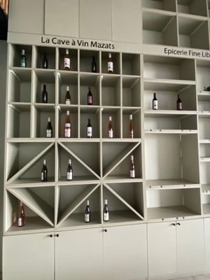 many bottles of wine on the shelves in the room