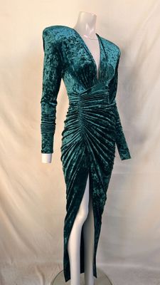 a green velvet dress on a mannequin mannequin mannequin mannequin mannequin mannequin mannequin mannequin manne