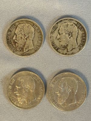 Trois pièces de monnaie britanniques différentes sont représentées sur un fond blanc.
