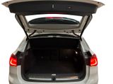 the back of a car with the trunk open and the trunk of the car in the back