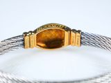 an image of a close up of a bracelet on a white surface