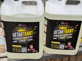 two gallons of deterant on the shelf in the store