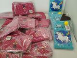 many bags of pink items on the table
