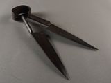 a pair of scissors that are on a table