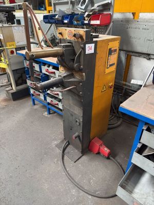 a machine that is sitting in a room with a lot of tools