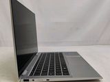 an open laptop computer sitting on top of a white table