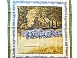 elephants in a field with trees in the background on a green and yellow scarf