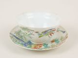 a small cup and saucer on a saucer on a table