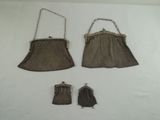 two brown purses and a pair of gloves sitting on a white surface