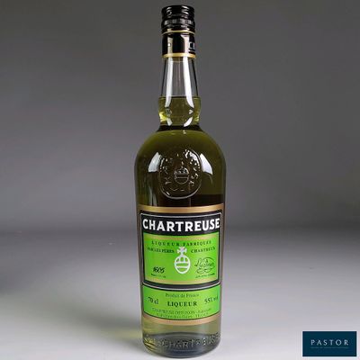 a bottle of chartreuse olive oil on a table