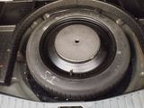 a close up view of a car ' s engine with a tire