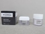Micro-masque Filorga avec sa boîte et son emballage, posé sur une table