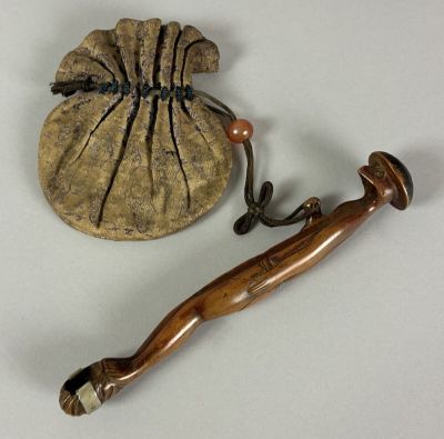 a small bag with a wooden handle and a wooden handle