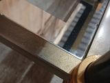 brass and glass coffee table in the style of person