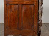 an old wooden chest of drawers sitting on top of a hard wood floor
