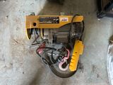 an overhead view of a small electric winch in a garage
