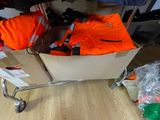 a cart full of luggage sitting on a wooden floor