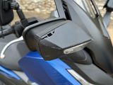 a close up of a motorcycle with a mirror on it