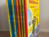 the children ' s books are lined up in a row on the floor
